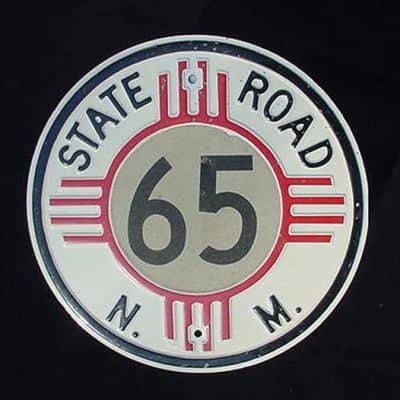 Heavy steel, reflective , embossed State Road 65 from New Mexico....( Our vintage signs Collection .)
